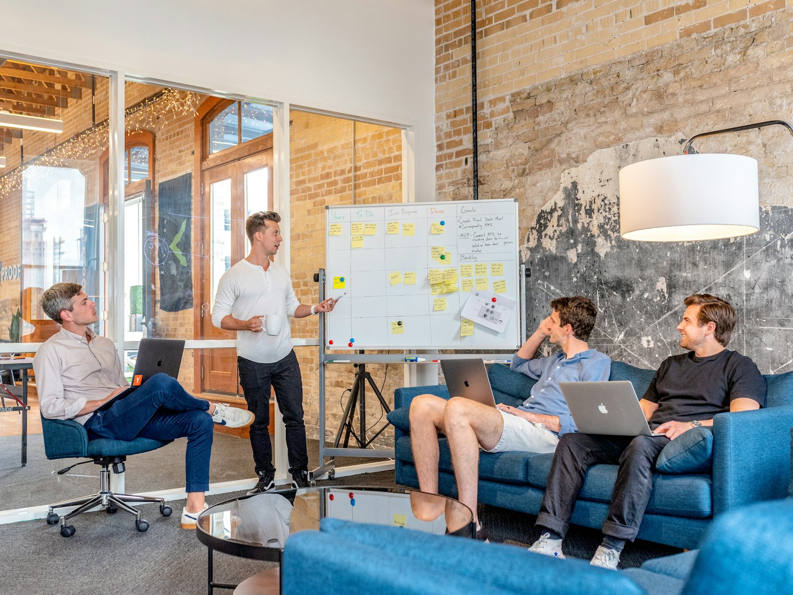 Team discussing a B2B go-to-market strategy framework at a whiteboard