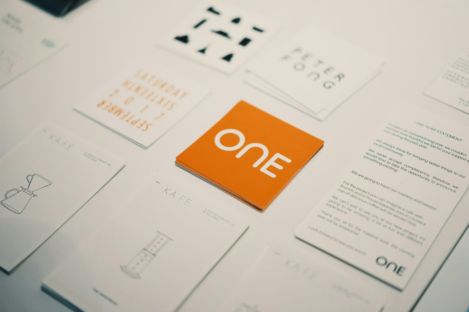 A distinctive orange brand card standing out among other brand identity cards