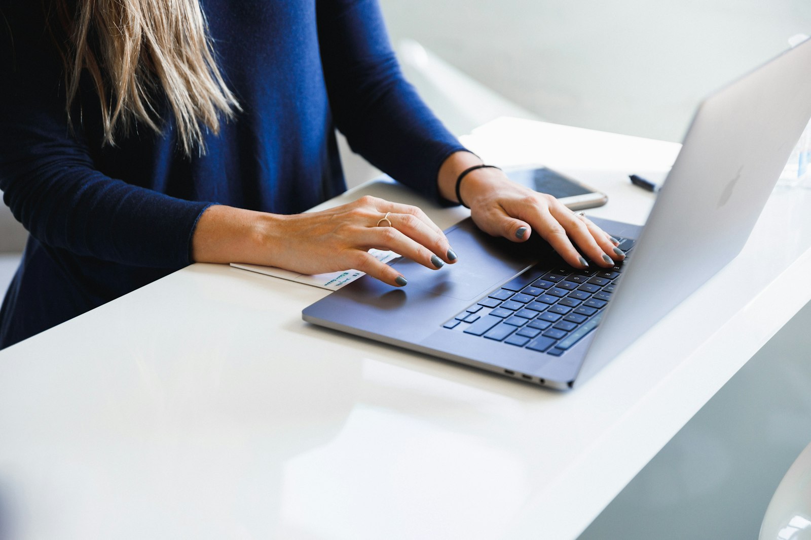 A founder updating her LinkedIn profile on a laptop to turn it into a pipeline